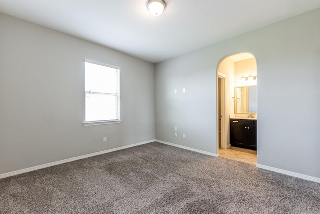 10318 Easterly Ln, Cypress, TX 77433 - unfurnished room with arched walkways and light colored carpet