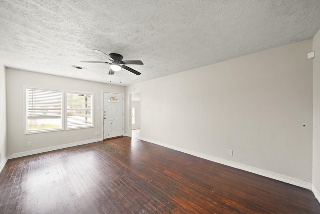 606 W 7th St, Freeport, TX 77541 - unfurnished room with a ceiling fan, dark wood-style flooring, and a textured ceiling