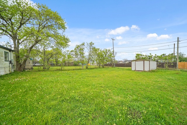 606 W 7th St, Freeport, TX 77541 - fenced backyard featuring a storage unit