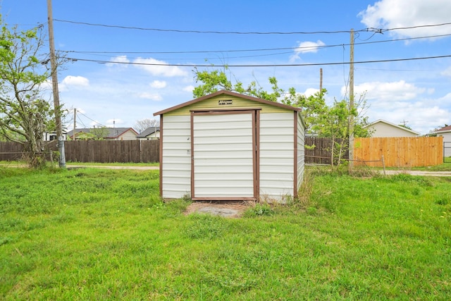 606 W 7th St, Freeport, TX 77541 - view of shed featuring a fenced backyard