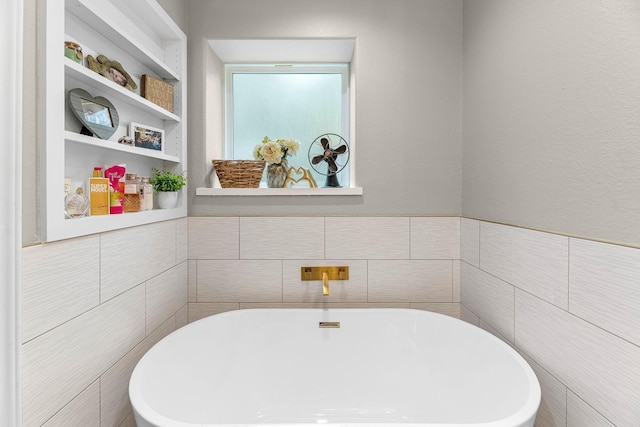 4439 W Bayshore Rd, Anahuac, TX 77514 - full bath featuring a freestanding bath and tile walls