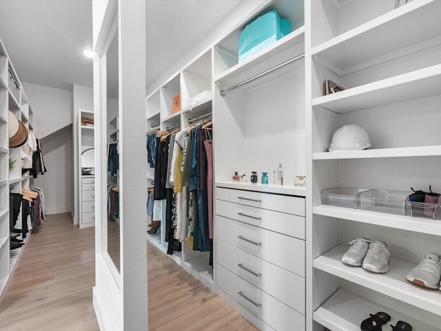 11319 Flying Admiral Dr, Cypress, TX 77433 - walk in closet with light wood-style floors
