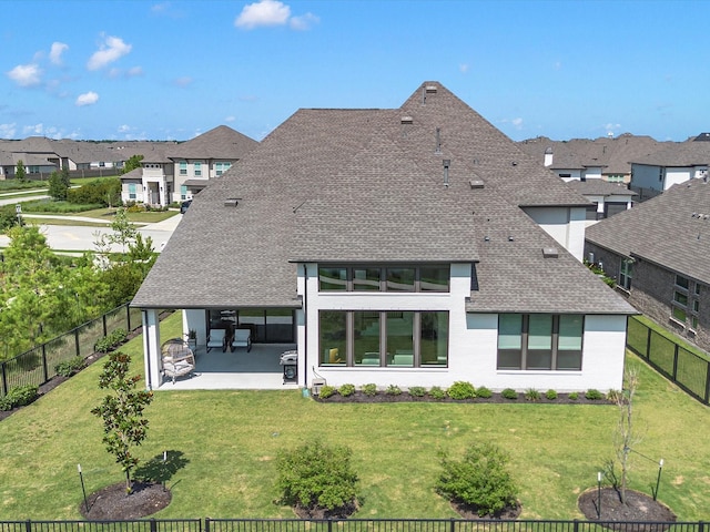 11319 Flying Admiral Dr, Cypress, TX 77433 - back of property featuring a shingled roof, a patio, a fenced backyard, and a residential view