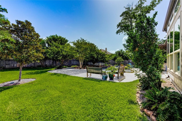 7003 Fall Creek Ln, Missouri City, TX 77459 - fenced backyard with a patio area