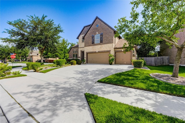 7003 Fall Creek Ln, Missouri City, TX 77459 - view of front facade featuring concrete driveway, stone siding, and an attached garage