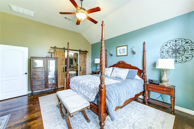 7003 Fall Creek Ln, Missouri City, TX 77459 - bedroom featuring a barn door, lofted ceiling, wood finished floors, and a ceiling fan