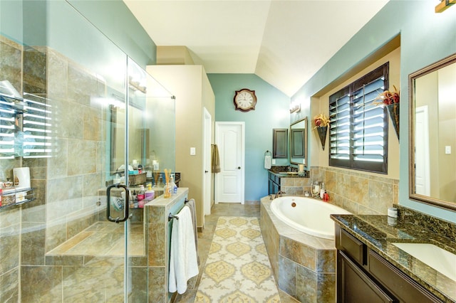 7003 Fall Creek Ln, Missouri City, TX 77459 - bathroom with a shower stall, two vanities, vaulted ceiling, and a garden tub
