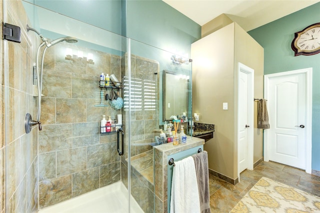 7003 Fall Creek Ln, Missouri City, TX 77459 - bathroom featuring a stall shower, stone finish flooring, and vanity