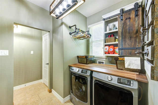 7003 Fall Creek Ln, Missouri City, TX 77459 - washroom featuring separate washer and dryer and light tile patterned floors