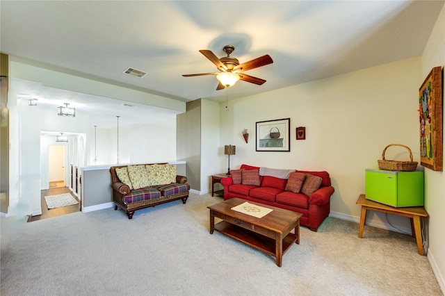 7003 Fall Creek Ln, Missouri City, TX 77459 - carpeted living area featuring ceiling fan and baseboards