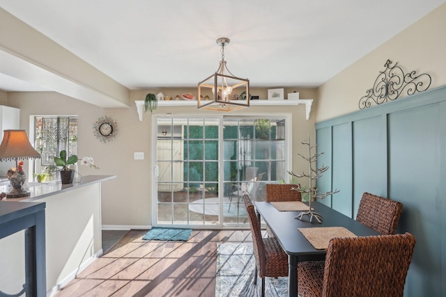 6355 Del Monte Dr Unit 64, Houston, TX 77057 - dining area featuring a chandelier and wood finished floors