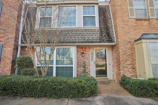 6355 Del Monte Dr Unit 64, Houston, TX 77057 - doorway to property with brick siding and roof with shingles