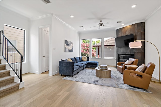 5223 Eigel St, Houston, TX 77007 - living area with light wood finished floors, stairs, ceiling fan, ornamental molding, and recessed lighting