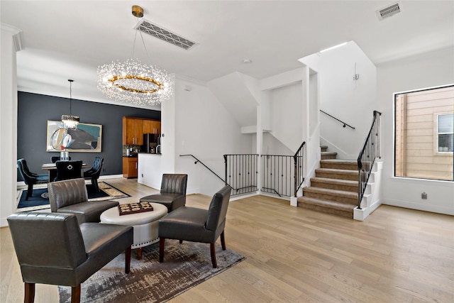 5223 Eigel St, Houston, TX 77007 - living room with a chandelier, light wood-style flooring, and stairway