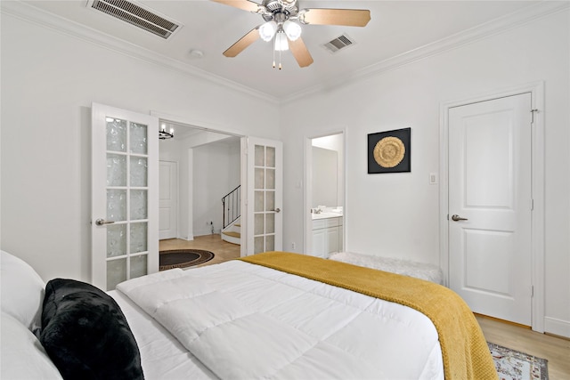5223 Eigel St, Houston, TX 77007 - bedroom featuring crown molding, light wood-style floors, ceiling fan, and connected bathroom