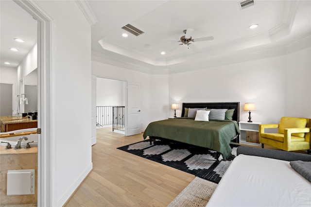 5223 Eigel St, Houston, TX 77007 - bedroom with light wood-style floors, a tray ceiling, crown molding, recessed lighting, and ceiling fan