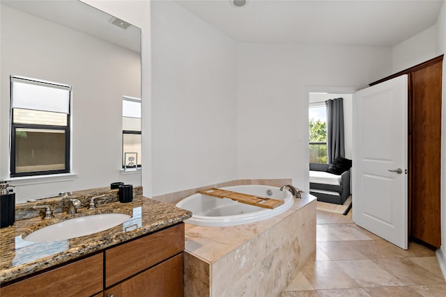 5223 Eigel St, Houston, TX 77007 - full bathroom with a tub with jets, vanity, and tile patterned flooring