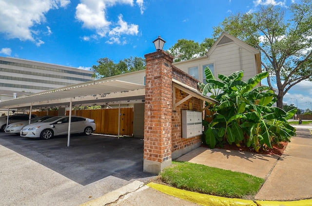 14707 Barryknoll Ln Unit 168, Houston, TX 77079 - covered parking lot featuring mail area