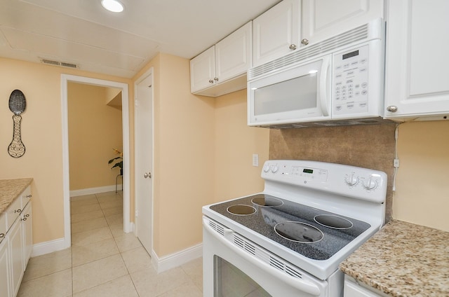 14707 Barryknoll Ln Unit 168, Houston, TX 77079 - kitchen featuring white appliances, white cabinets, and light tile patterned floors