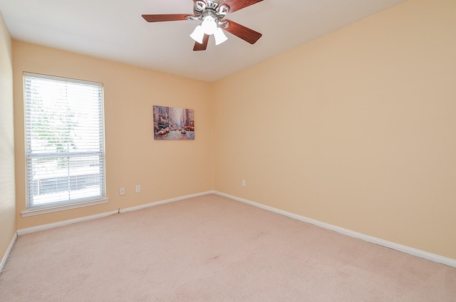 14707 Barryknoll Ln Unit 168, Houston, TX 77079 - empty room with light carpet, healthy amount of natural light, and a ceiling fan