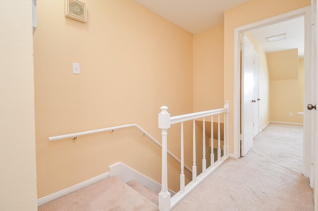 14707 Barryknoll Ln Unit 168, Houston, TX 77079 - hall featuring carpet and an upstairs landing