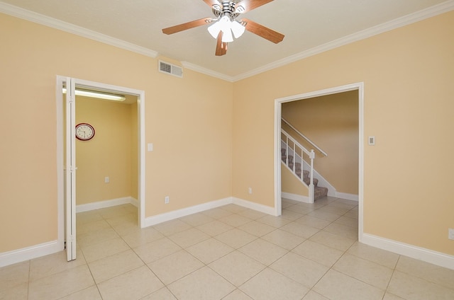 14707 Barryknoll Ln Unit 168, Houston, TX 77079 - spare room featuring crown molding, a ceiling fan, stairs, and light tile patterned floors