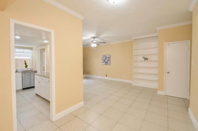 14707 Barryknoll Ln Unit 168, Houston, TX 77079 - unfurnished room featuring a ceiling fan, built in shelves, crown molding, and light tile patterned floors
