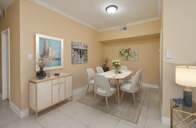 14707 Barryknoll Ln Unit 168, Houston, TX 77079 - dining area featuring ornamental molding and light tile patterned floors