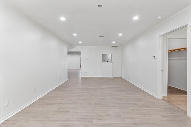 10906 Keese Dr, Houston, TX 77089 - spare room with recessed lighting, light wood-style flooring, a smoke detector, and crown molding