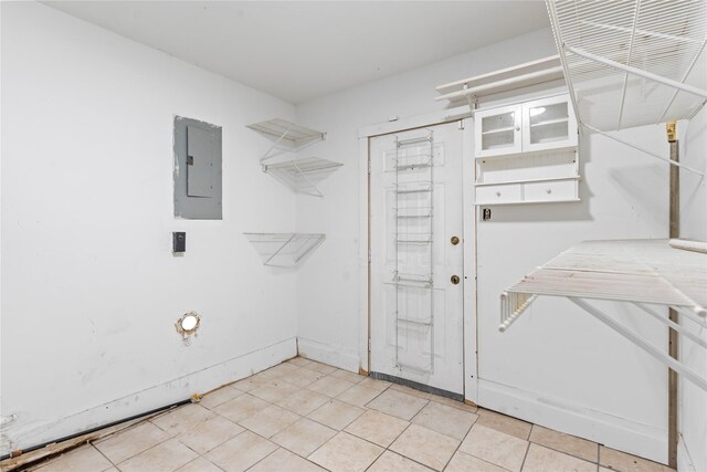 10906 Keese Dr, Houston, TX 77089 - washroom with electric panel and light tile patterned floors