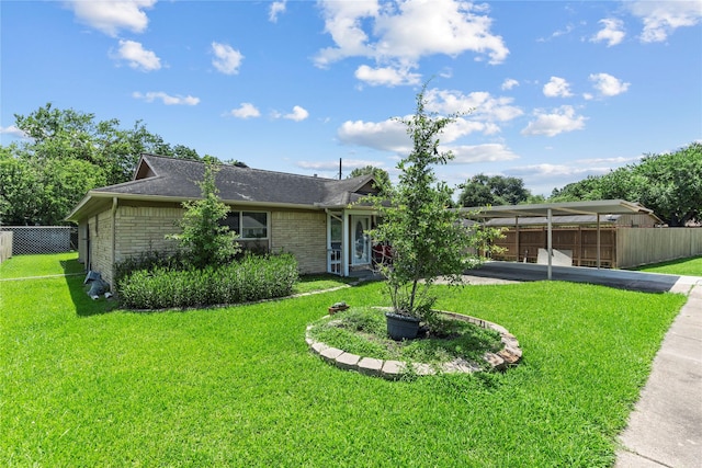 10906 Keese Dr, Houston, TX 77089 - view of front of home with brick siding, roof with shingles, and a carport