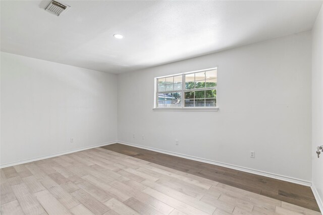 10906 Keese Dr, Houston, TX 77089 - empty room with wood finished floors and recessed lighting