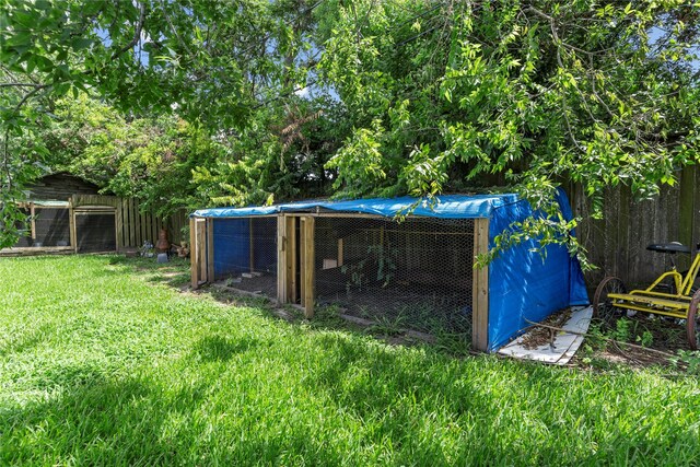 10906 Keese Dr, Houston, TX 77089 - view of yard with exterior structure and an outbuilding