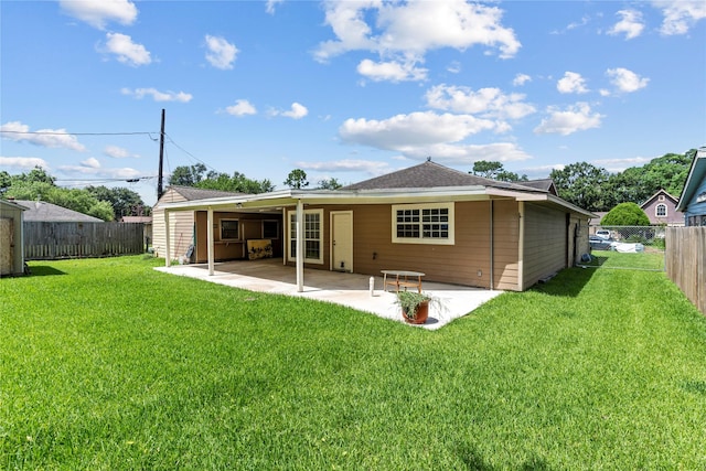 10906 Keese Dr, Houston, TX 77089 - back of property featuring a fenced backyard, a patio, and roof with shingles