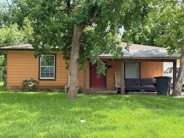 1402 18th St, Galena Park, TX 77547 - view of front of property with a front yard and a shingled roof