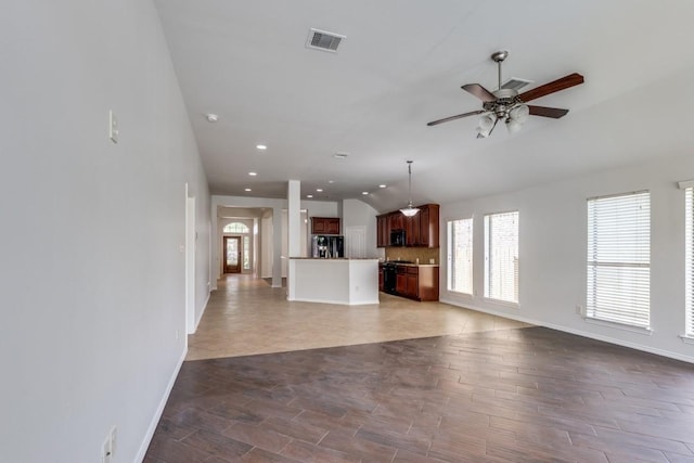 16223 Cotton Grove Ln, Houston, TX 77044 - unfurnished living room featuring a ceiling fan, vaulted ceiling, and recessed lighting