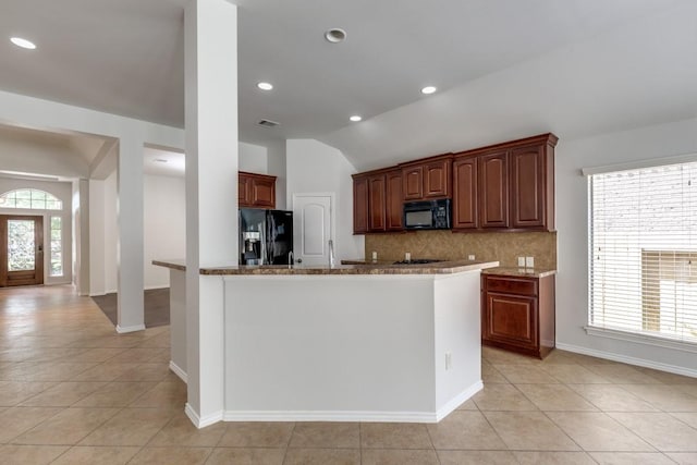 16223 Cotton Grove Ln, Houston, TX 77044 - kitchen with black appliances, backsplash, lofted ceiling, light tile patterned flooring, and recessed lighting