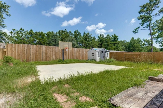 16223 Cotton Grove Ln, Houston, TX 77044 - fenced backyard featuring a storage unit and basketball hoop