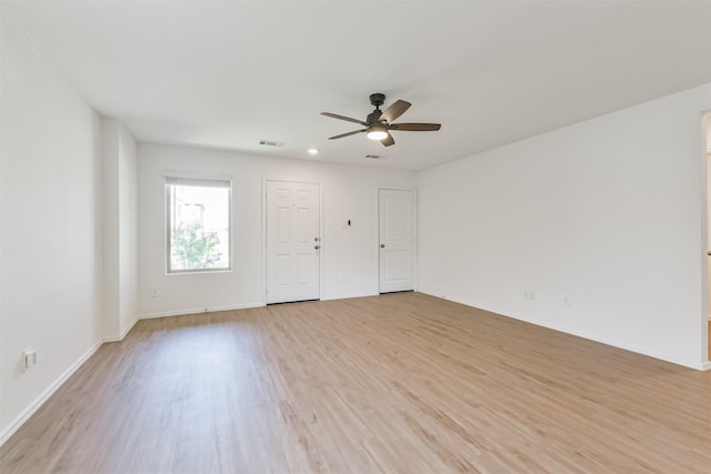 17427 Cyprian Cedar Ln, New Caney, TX 77357 - empty room with ceiling fan and light wood-style flooring