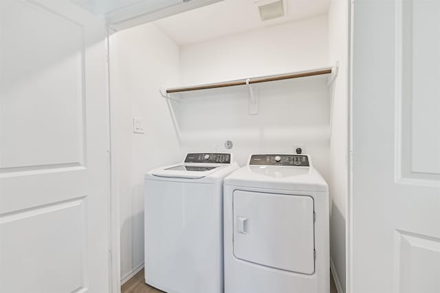 17427 Cyprian Cedar Ln, New Caney, TX 77357 - laundry area with washing machine and clothes dryer