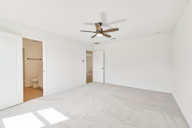 17427 Cyprian Cedar Ln, New Caney, TX 77357 - unfurnished bedroom with carpet floors, ensuite bathroom, and ceiling fan