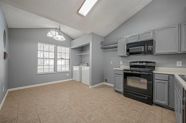 7770 Pine Center Dr, Houston, TX 77095 - kitchen featuring black appliances, separate washer and dryer, gray cabinets, vaulted ceiling, and light countertops
