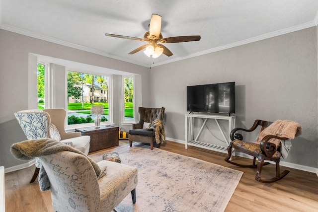 24111 Norchester Way, Spring, TX 77389 - living room featuring healthy amount of natural light, ceiling fan, wood finished floors, and ornamental molding