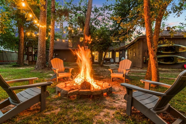 24111 Norchester Way, Spring, TX 77389 - yard at dusk featuring an outdoor fire pit