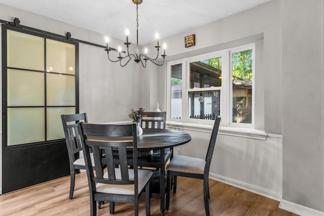 24111 Norchester Way, Spring, TX 77389 - dining area featuring wood finished floors and a chandelier