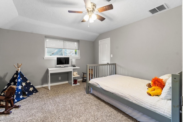 24111 Norchester Way, Spring, TX 77389 - carpeted bedroom with a textured ceiling, ceiling fan, and vaulted ceiling