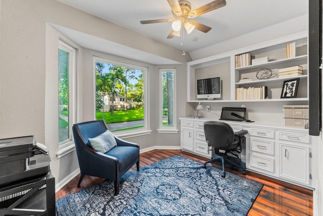 24111 Norchester Way, Spring, TX 77389 - home office with built in desk, a ceiling fan, and dark wood-style floors