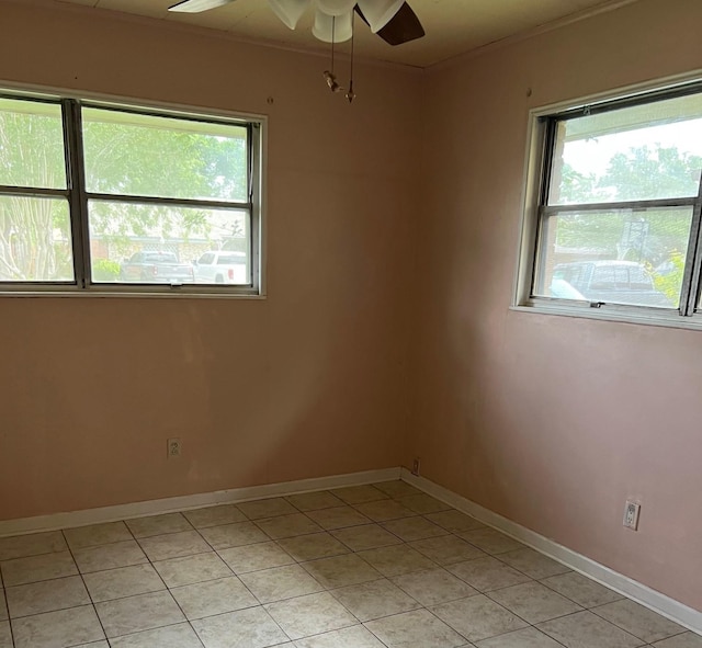 10106 Hinds St, Houston, TX 77034 - empty room with plenty of natural light, ceiling fan, light tile patterned floors, and crown molding