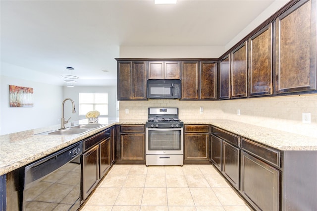 9207 Ranch Ridge Ln, Richmond, TX 77407 - kitchen with black appliances, dark brown cabinets, decorative backsplash, and light tile patterned floors