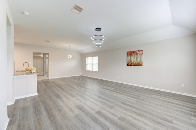 9207 Ranch Ridge Ln, Richmond, TX 77407 - unfurnished living room with light wood-type flooring and lofted ceiling